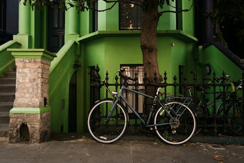 Bicycle Parked under Green House