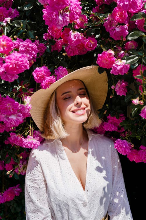 Flowers around Posing Blonde Woman