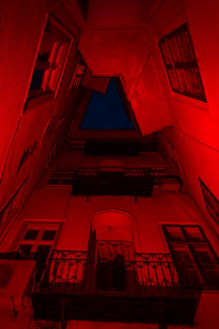 An Antique Building In Red Light