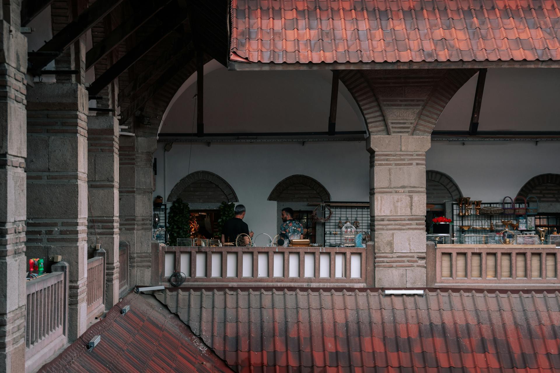 View of a historic building's mezzanine in Ankara featuring people and intricate architecture.