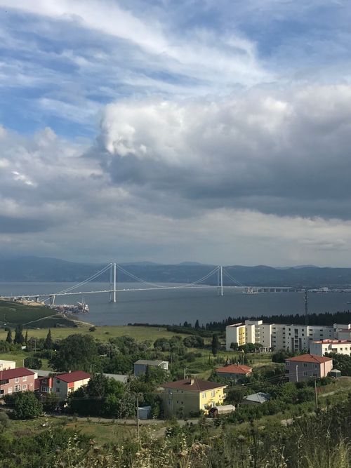 Free Scenic view of the Bosphorus Bridge and urban landscape in Istanbul under cloudy skies. Stock Photo