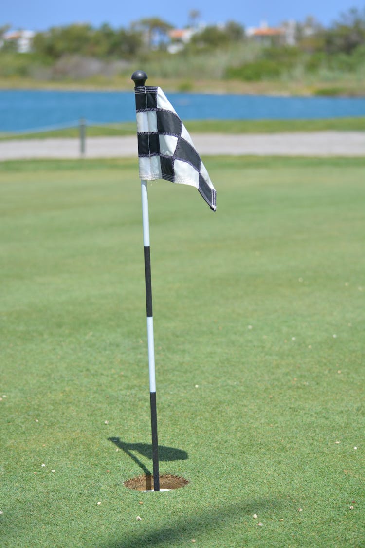 Checkered Flag In The Golf Course Hole