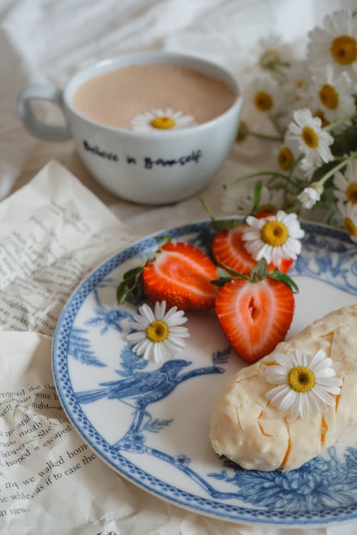 Ice Cream and Strawberries Served with Coffee and Chamomile Flowers