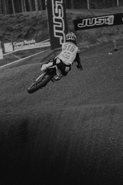 Back View of Jumping Rider in Motocross Race