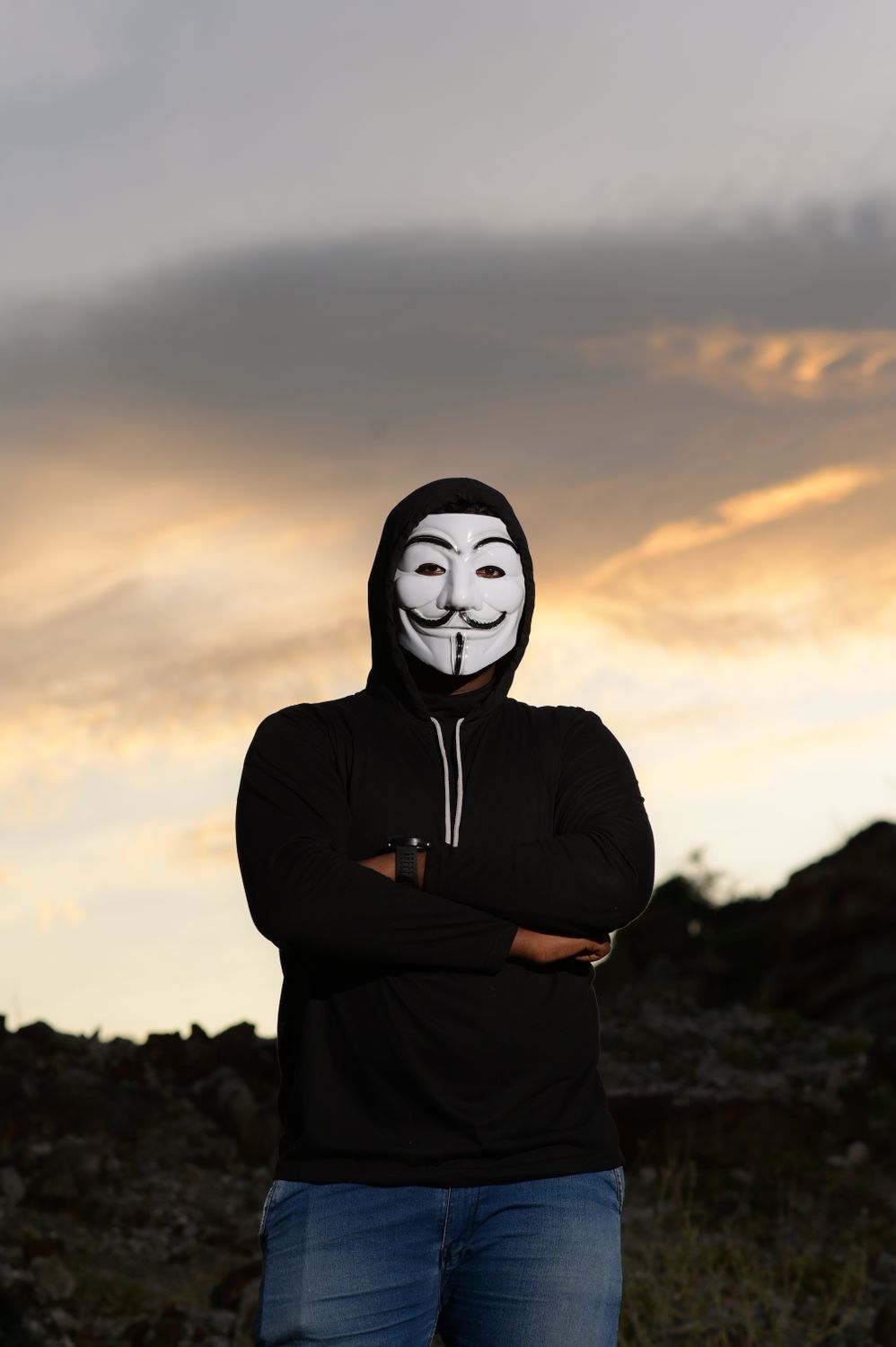Guy With Mask Man in Guy Fawkes Mask Standing with Arms Crossed · Free Stock Photo