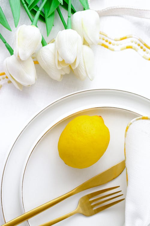 Free A Whole Lemon on a White Plate  Stock Photo