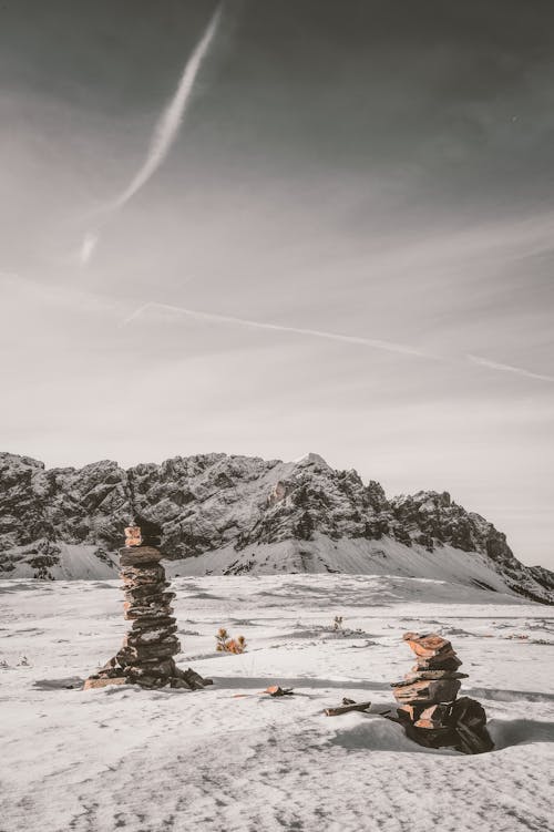 Stack of Stones on Snow Covered Field