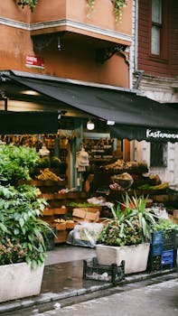 Explore a bustling urban market stall with fresh fruits and vegetables in a vibrant city setting.