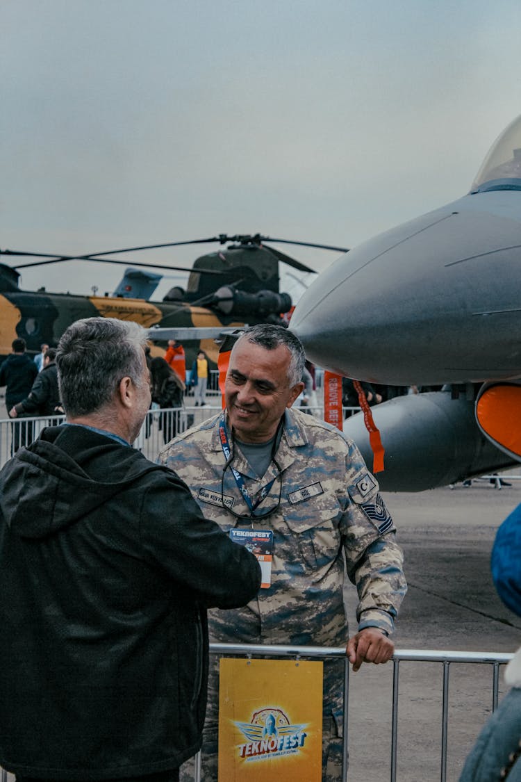 Men Talking At Military Air Show