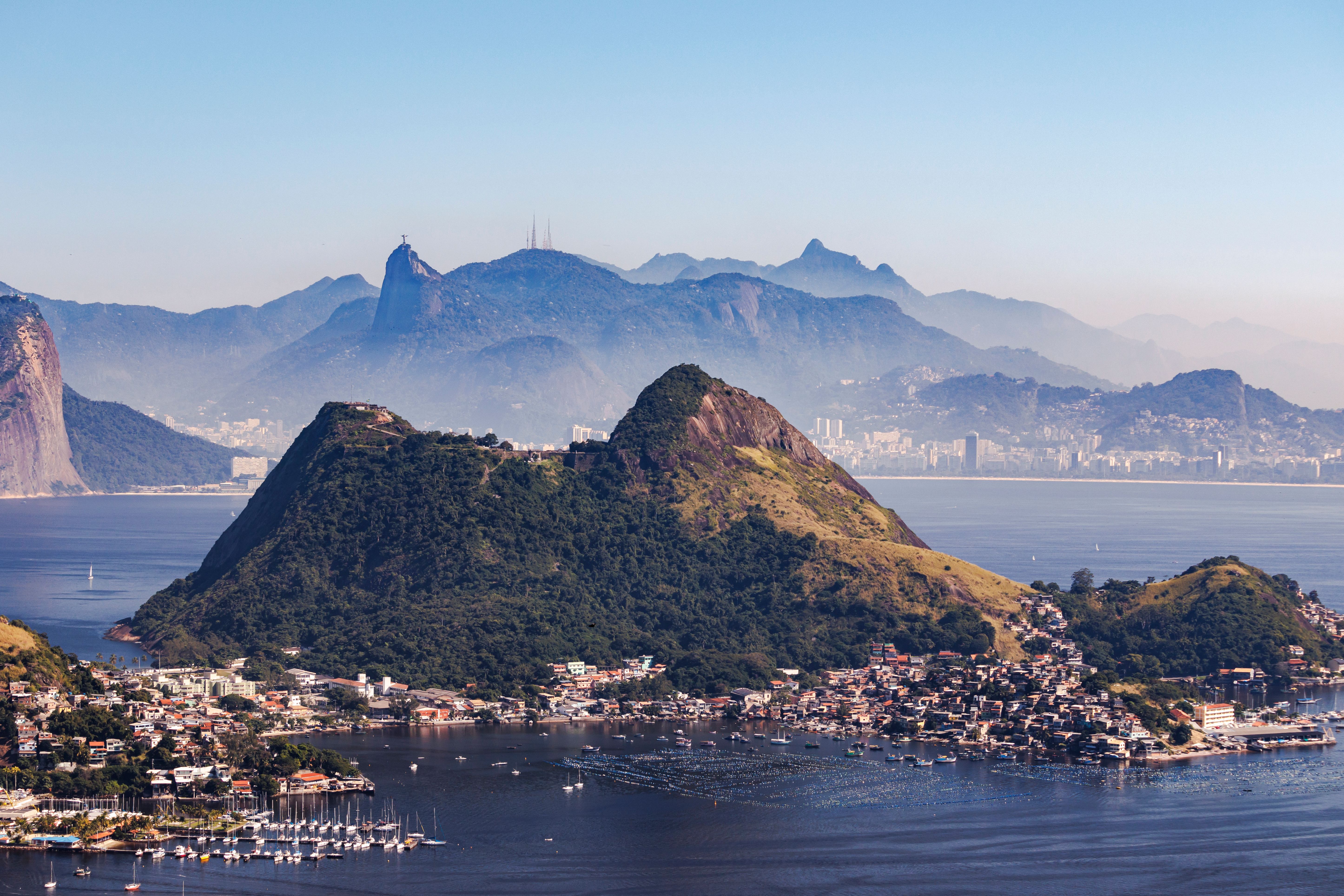 Amazing Helicopter Ride in Rio de Janeiro - 30 Minutes by Comandante Nobre Review Review 2026 - Stunning aerial view of Niterói, Brazil with Sugarloaf Mountain and scenic coastlines.