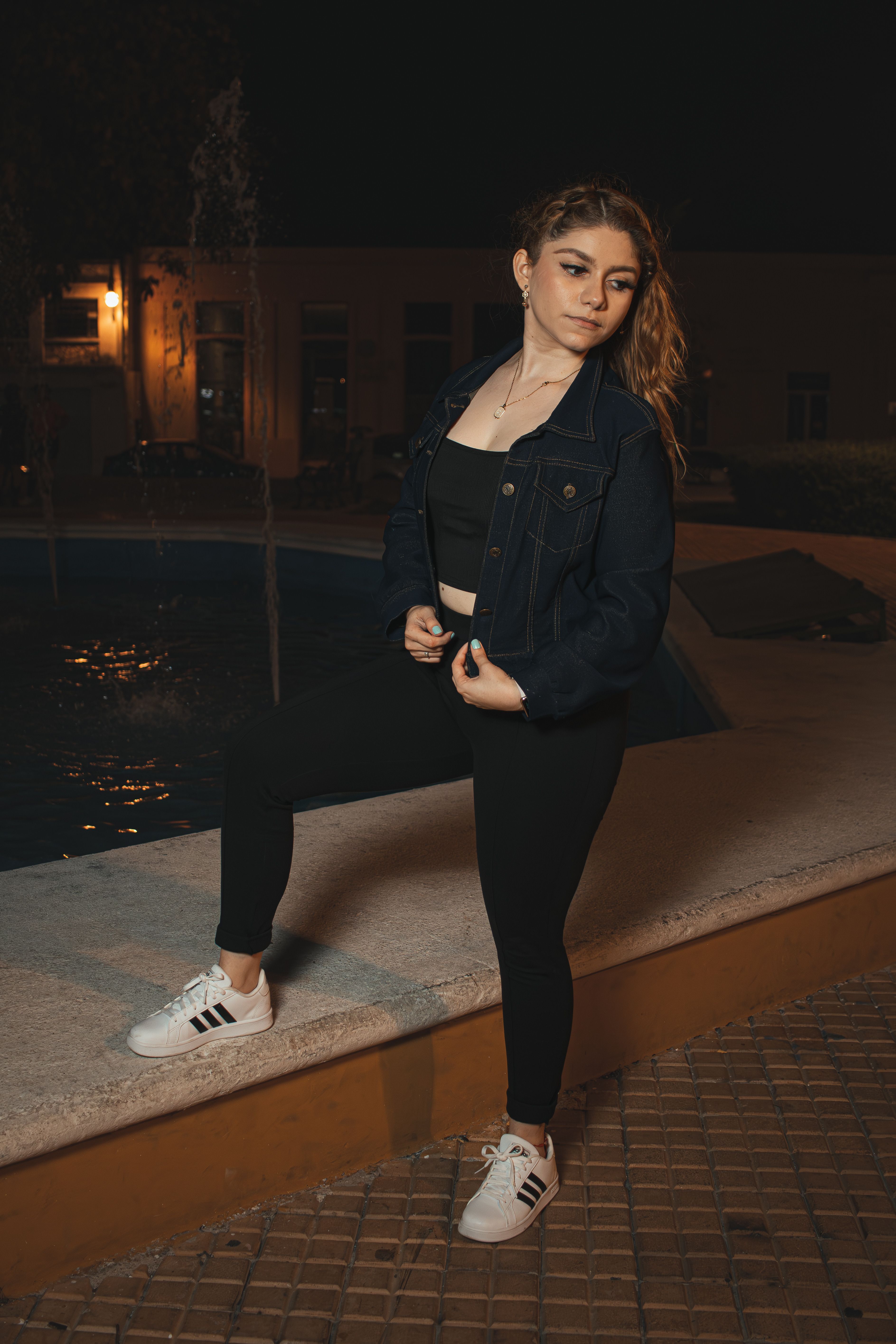 Woman Posing at Night in Denim Jacket · Free Stock Photo