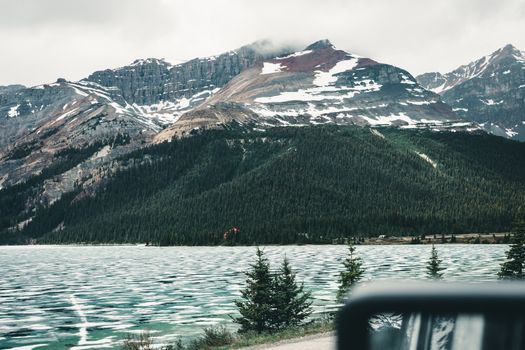 Explore the breathtaking landscapes of Jasper National Park with snow-capped mountains and serene lakes.