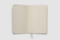 Open Notebook with Blank Pages on White Background