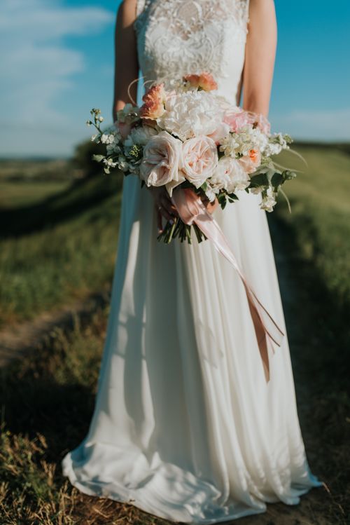 Bride holding an elegant bridal bouquet