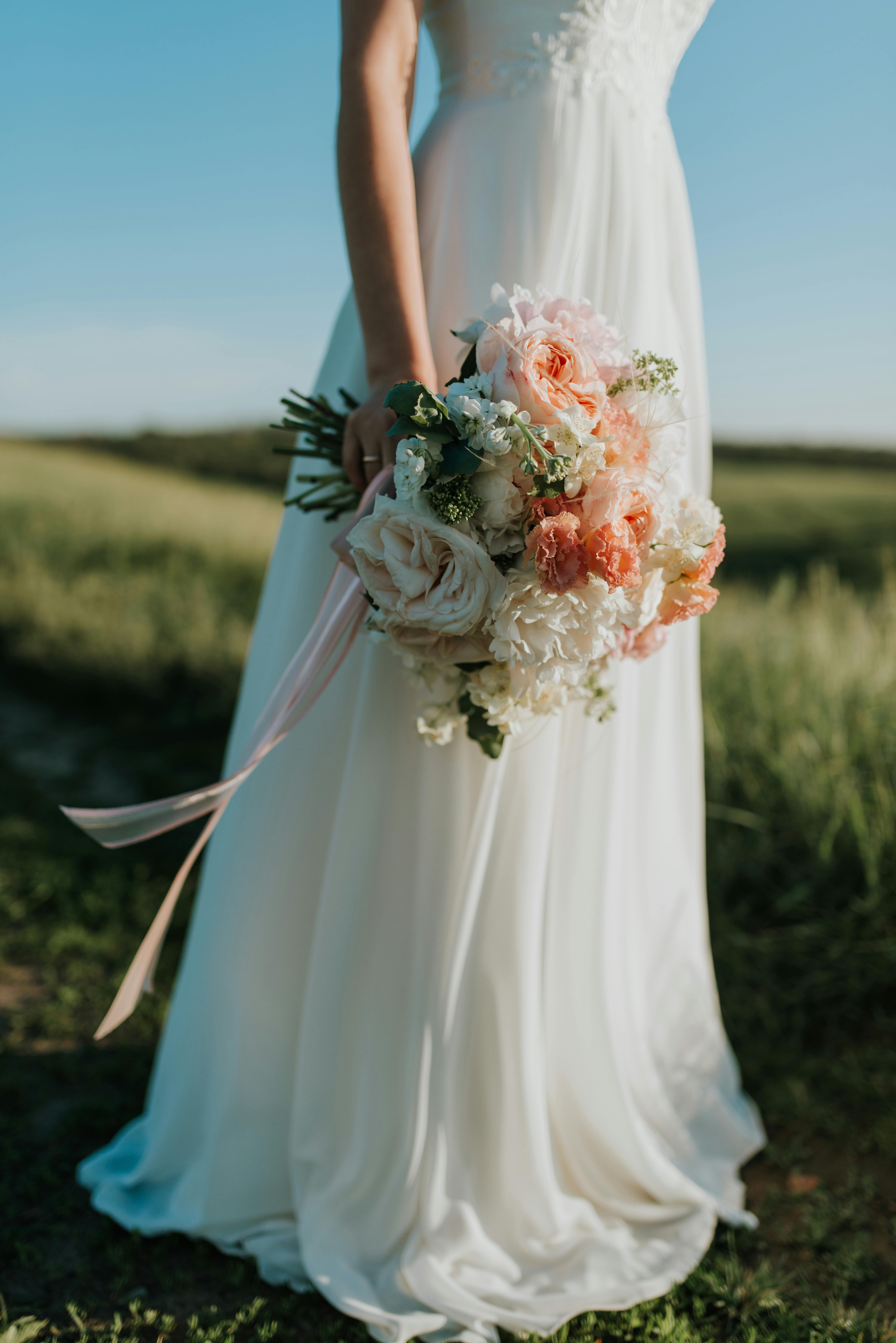 white dress with flowers to a wedding