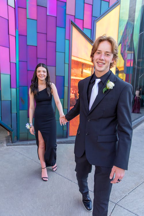 Smiling Couple in Black Dress and Black Suit