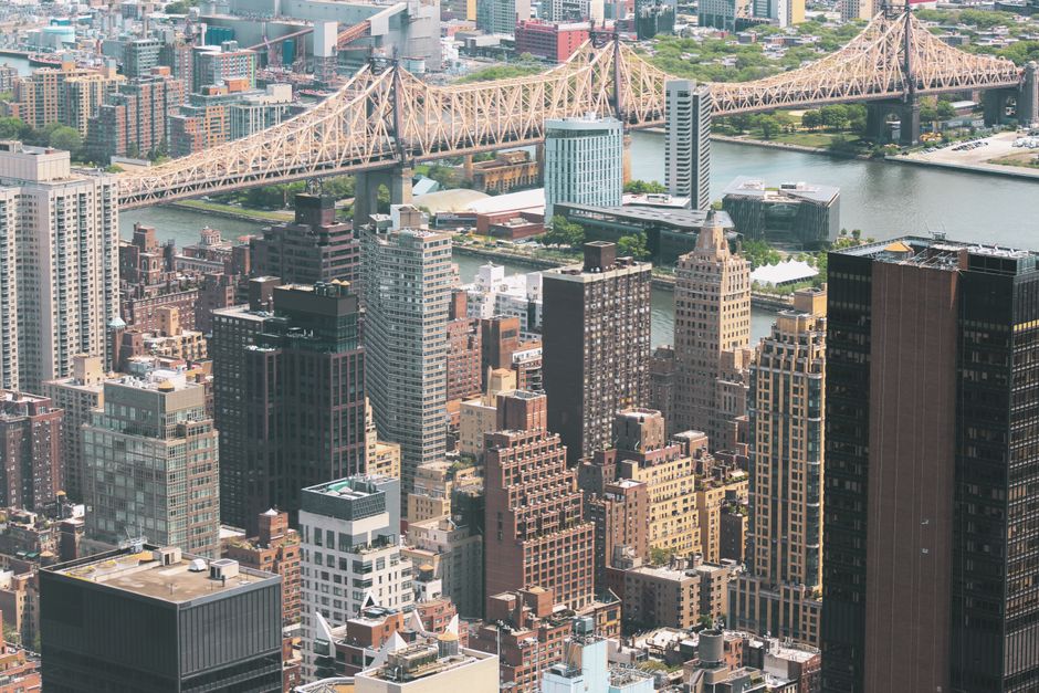 Unbeatable Deluxe Manhattan Helicopter Tour Review: The Ultimate 18-Minute NYC Adventure Review 2026 - Stunning aerial view of New York City's iconic skyline featuring skyscrapers and the Queensboro Bridge.