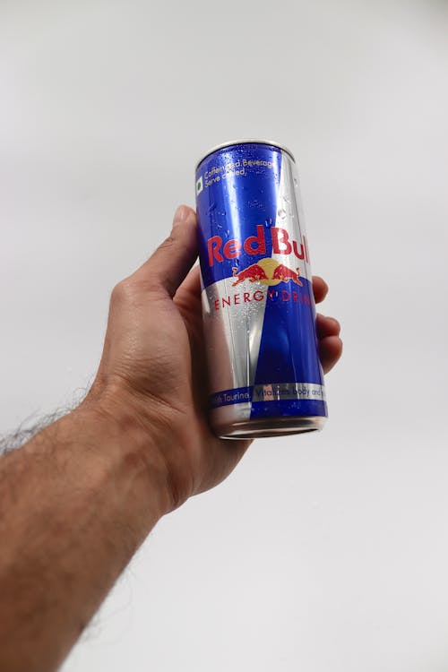 Man Hand Holding Red Bull Energy Drink Can