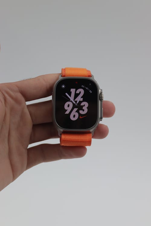 Apple watch series 4 orange sport band Free Stock Photo