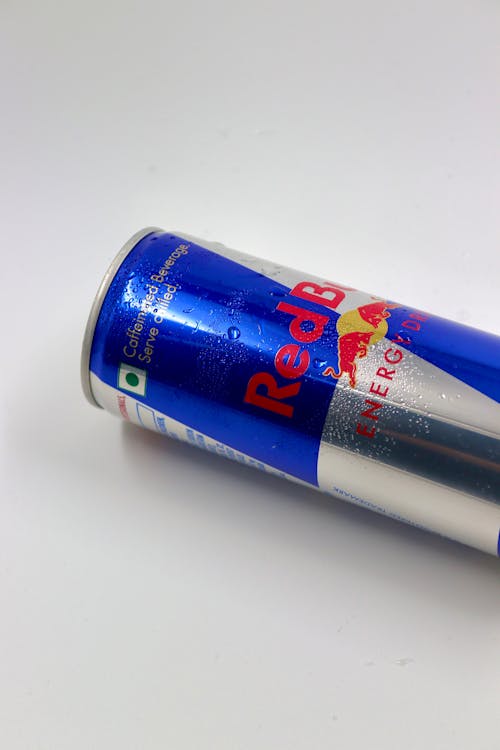 Red Bull Can Lying on a White Background