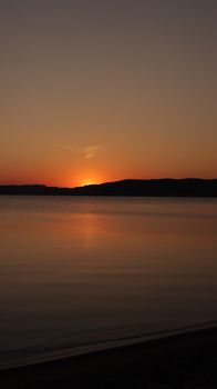 Beautiful sunset over placid Lake Vättern, Jönköping County in Sweden. Perfect for travel inspiration.