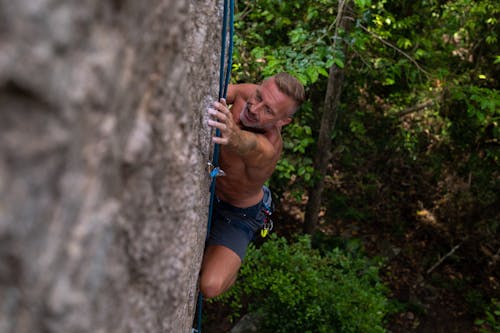 Topless Man Rock Climbing