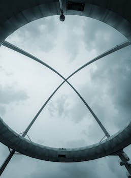 Dramatic cloudscape through modern architectural skylight in New Town, India.
