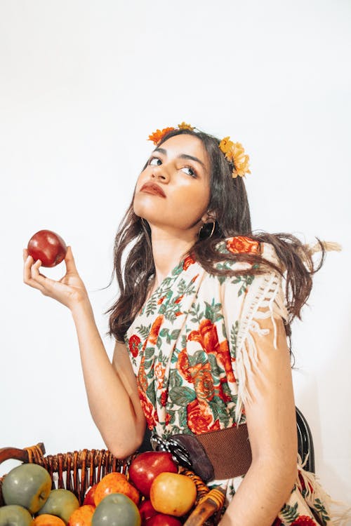 Brunette Woman in Dress Posing with Fruit