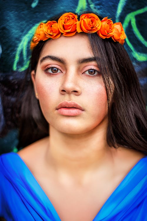 Brunette Woman Posing with Flowers Wreath