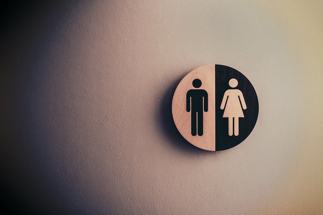 Free Male and Female Signage on Wall Stock Photo