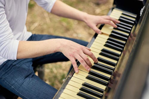 Man Playing the Piano Outside 