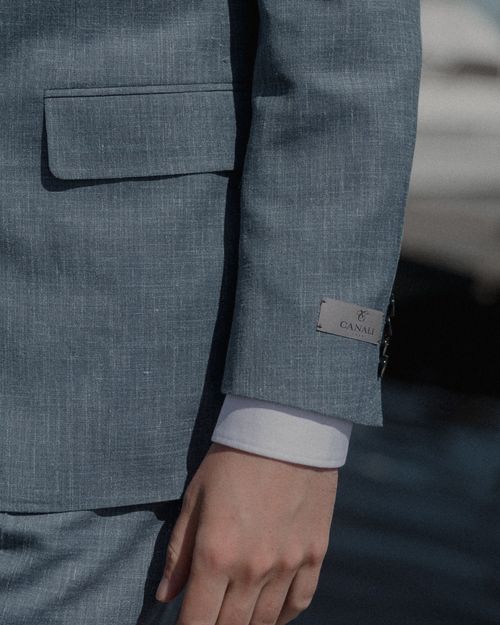 Free Detailed close-up of a person's hand in a gray suit showcasing sophisticated fashion elements. Stock Photo