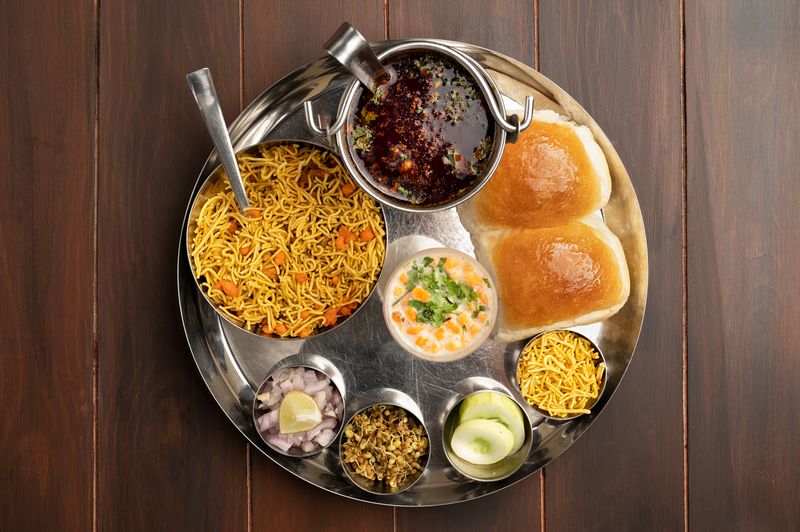Authentic misal pav meal on a traditional thali