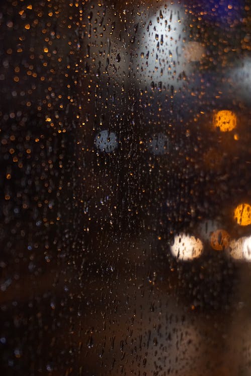 Raindrops on Glass at Night