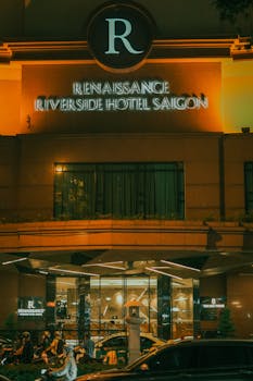Illuminated entrance of Renaissance Riverside Hotel Saigon, Vietnam.