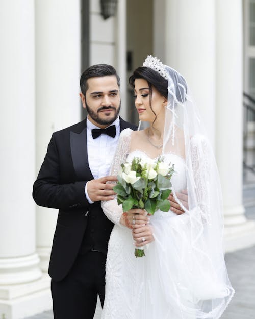 Groom Embracing Bride