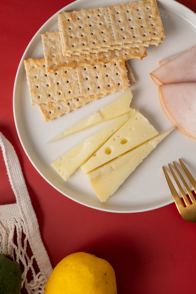 Crackers And Cheese With Ham On The Plate 