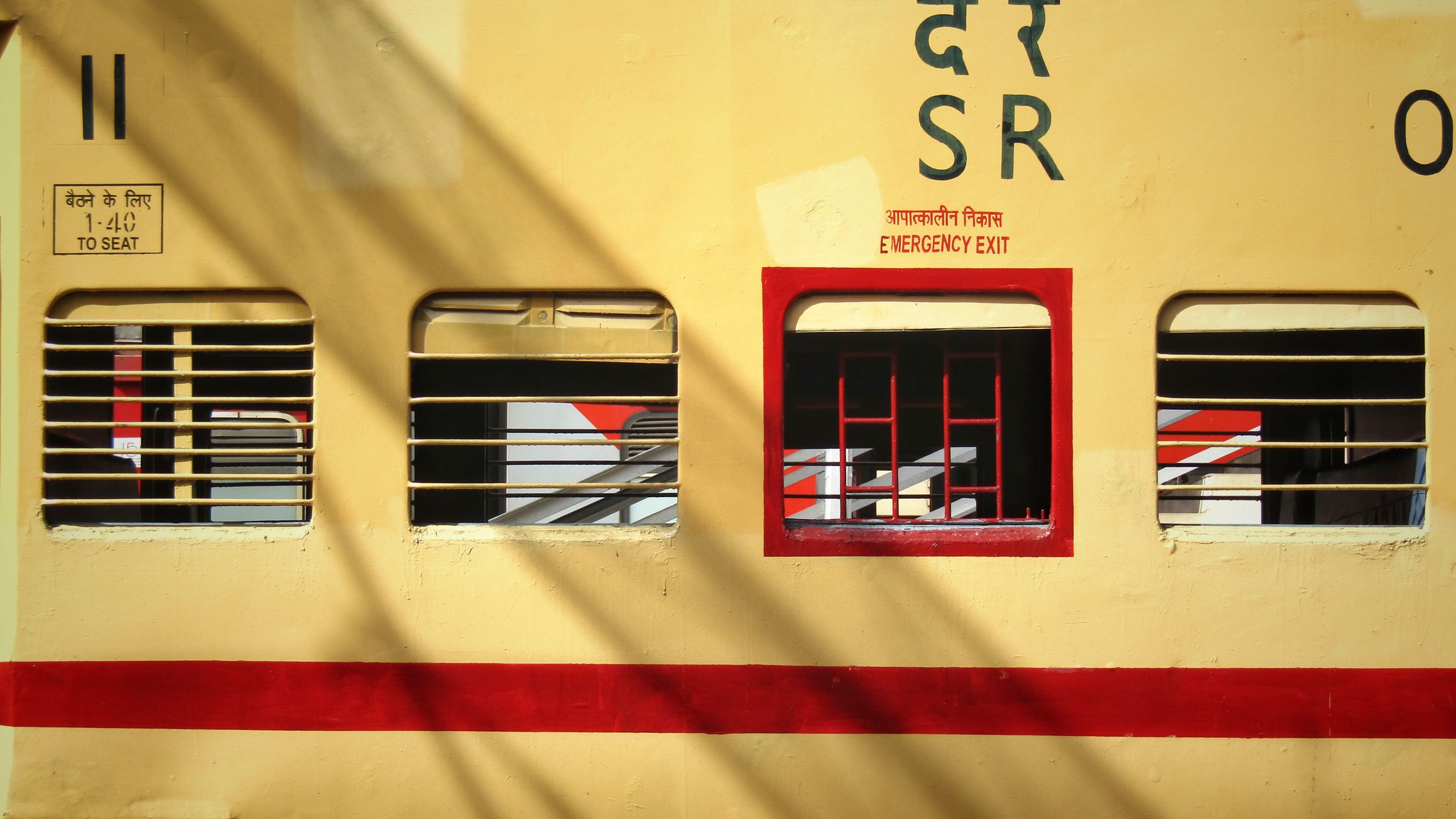 Red Emergency Exit Window in Train · Free Stock Photo