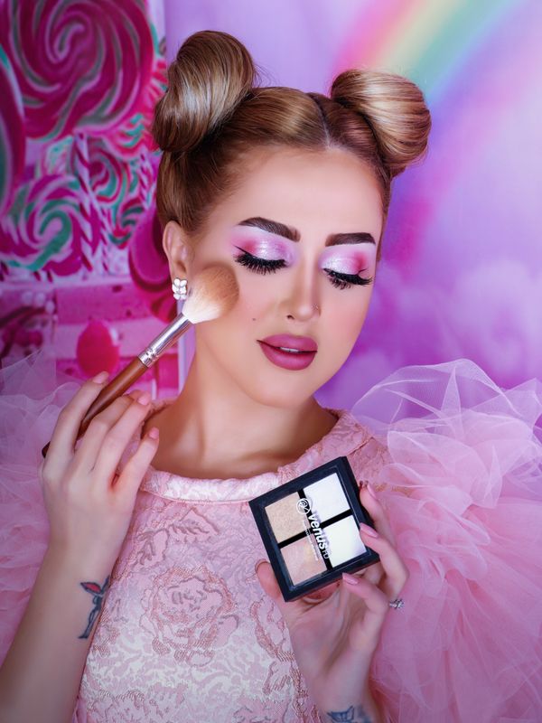 Playful pink glam with space buns
