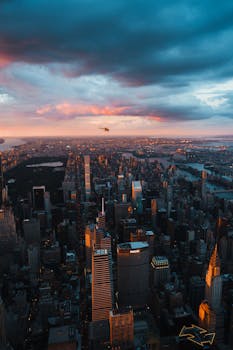 Stunning aerial photograph of Manhattan's skyline during dawn showcasing iconic New York City architecture.