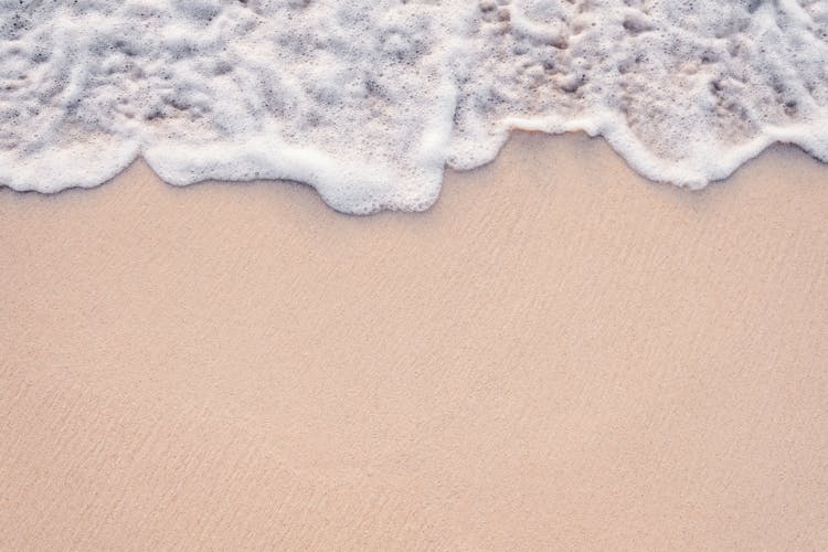 Water Foam On Beach