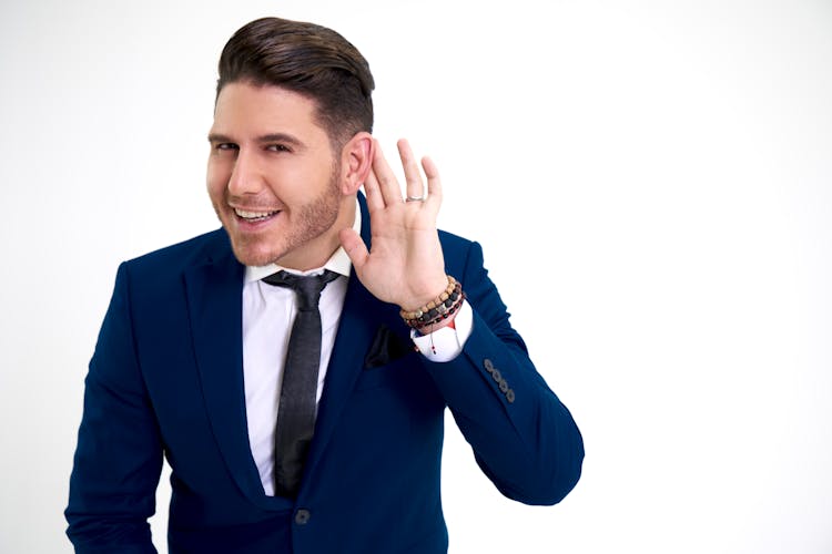 Man In Suit Posing In Studio