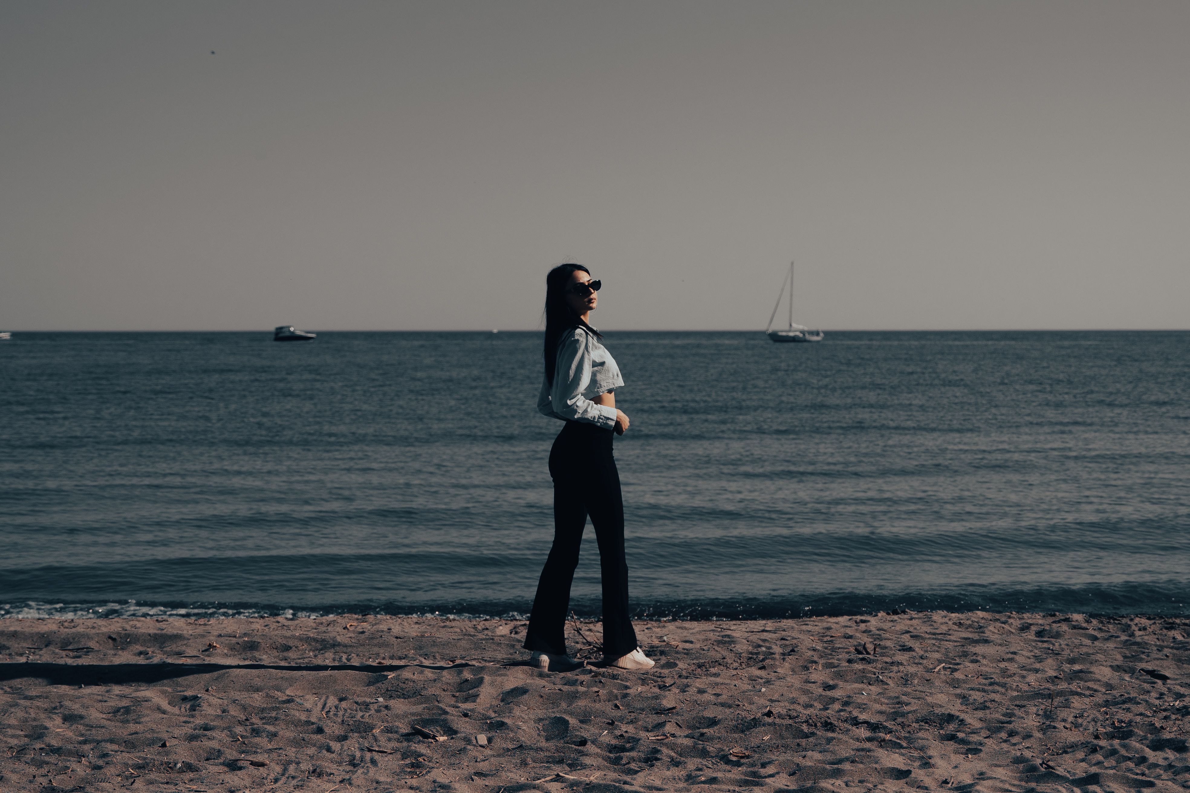 Woman Posing on Sandy Beach · Free Stock Photo