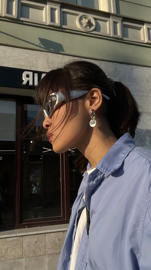 Brunette Woman in Jacket with Sunglasses on Street