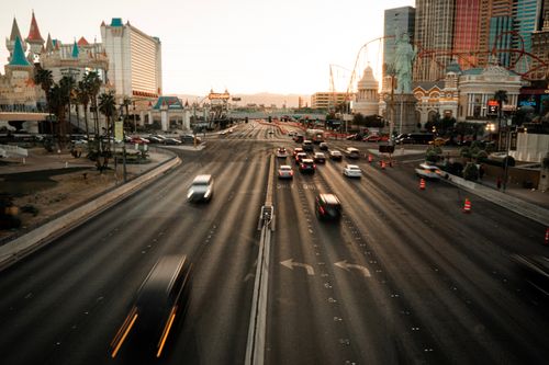 Free Aerial view of the busy Las Vegas Strip with iconic landmarks during sunset. Stock Photo