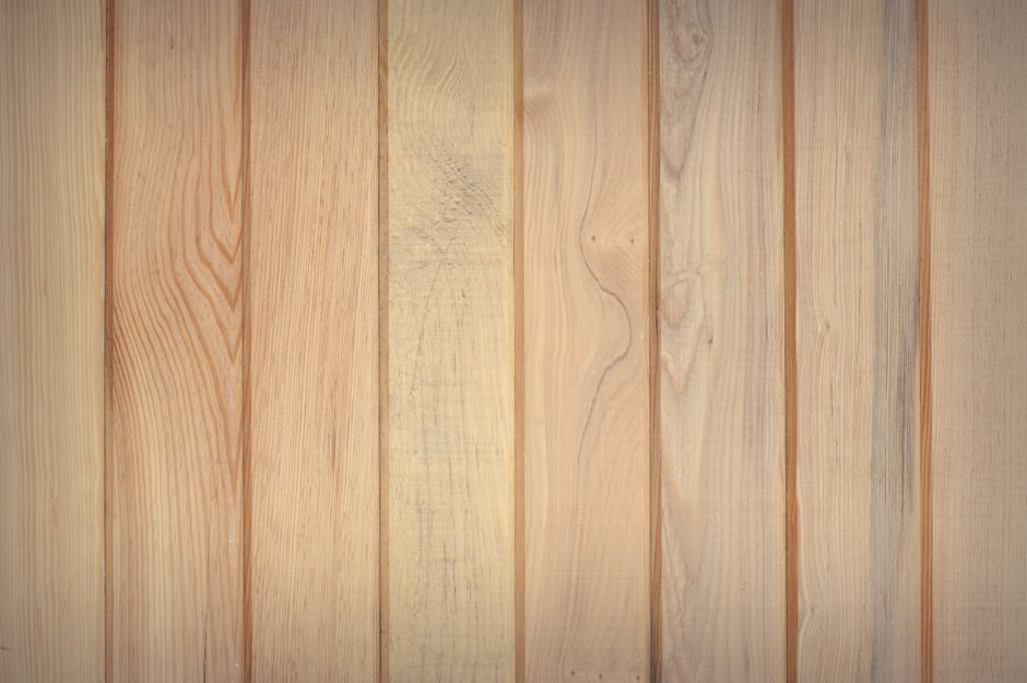 Rustic natural wood planks showcasing varied grain patterns and textures, perfect for backgrounds.