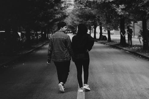 Couple Walking on Road in Black and White