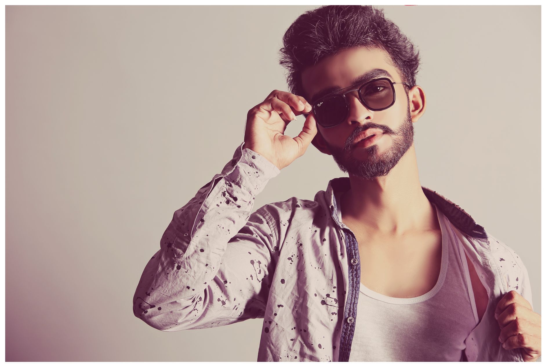 Man being photographed in soft natural light from a proper distance, the setup that removes most close-range distortion