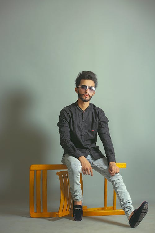 Photo of Man Sitting on Chair