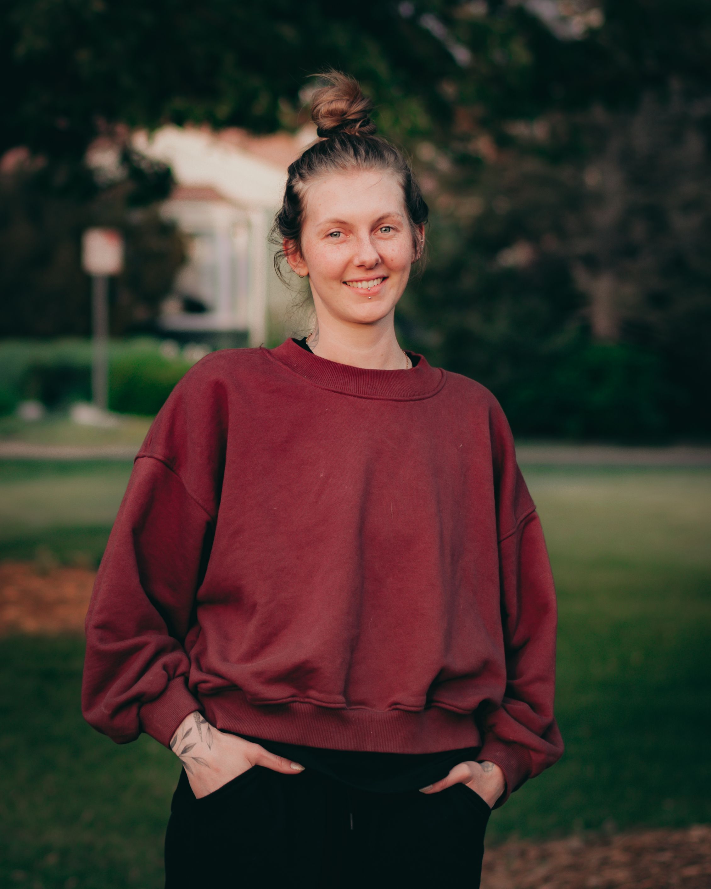 Portrait of Smiling Woman Posing in Green Park · Free Stock Photo